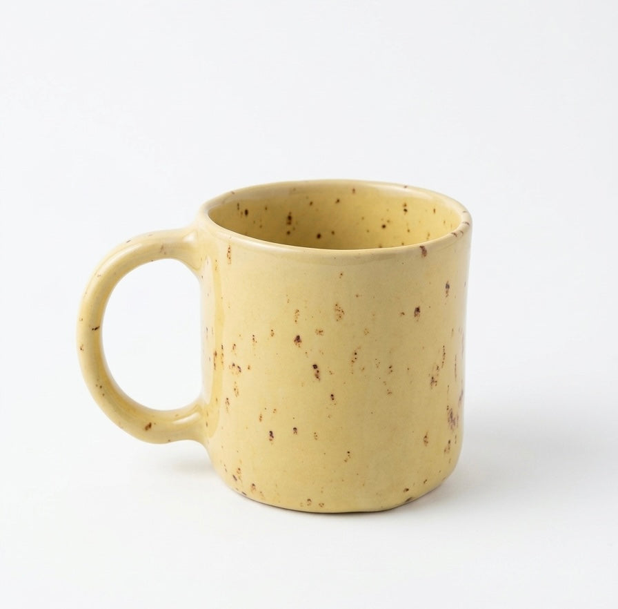 Tea cup yellow speckled